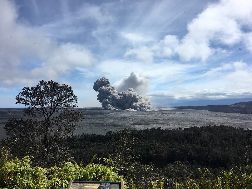 View of a rising ash plume from Halema‘uma‘u, a crater at the summit of Kīlauea, late Thursday 24 May, 2018, as seen from the caldera rim near Volcano House. After having to abandon the volcano observatory closer to Halema’uma’u crater due to earthquake damage and risk of explosions, USGS scientists are stationed at this vantage point to track the ongoing summit activity. (HVO/USGS).