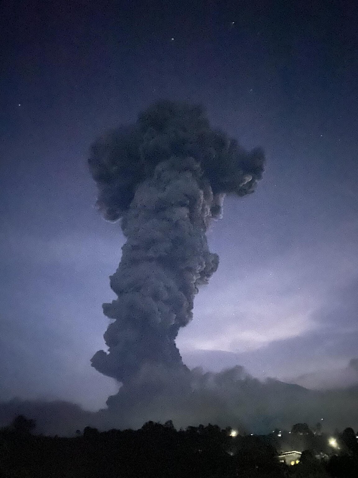 A towering pillar of ash and gas, ingested air and other ejecta rose from the crater of Kanlaon volcano today (image: @PunchTheLies/X)