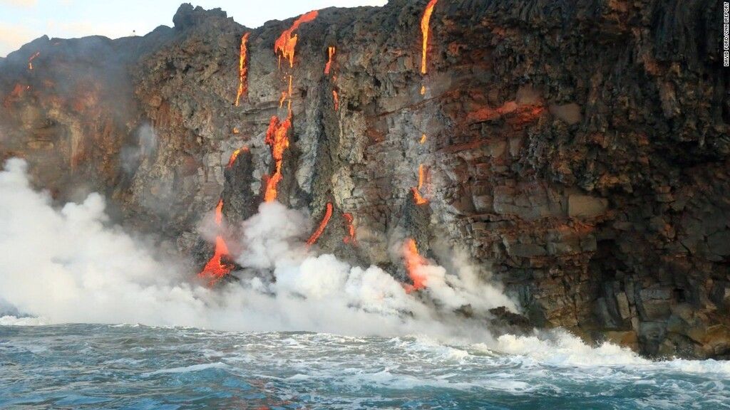 Lava falls down the cliff at Hawaii (image David Ford / CNN)