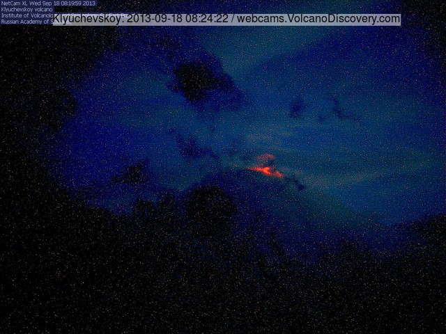 Klyuchevskoy volcano last evening with glow from the active lava flow