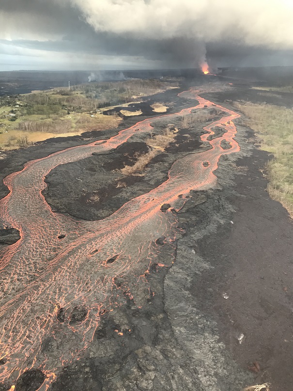 Image taken on Tuesday morning June 12, 2018, showing the active perched channel with braided lava flows that is fed by Fissure 8 (fountain visible in the distance). (HVO/USGS)