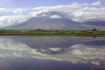 Lengai volcano mirrored in Lake Natron (photo: Philip Benham)