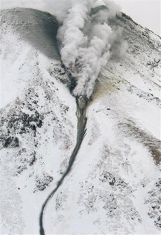 Smoke rising from Meakandake volcano and a mud flow travelling from the summit through a ravine. (AP Photo/Kushiro Local Metrological Observatory via Kyodo News)