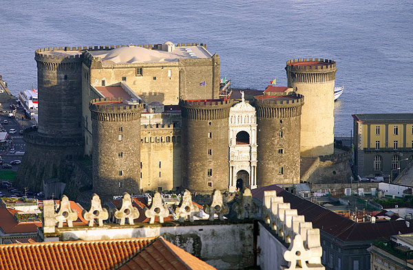 The medieval Maschio Angioino castle in the port of Naples