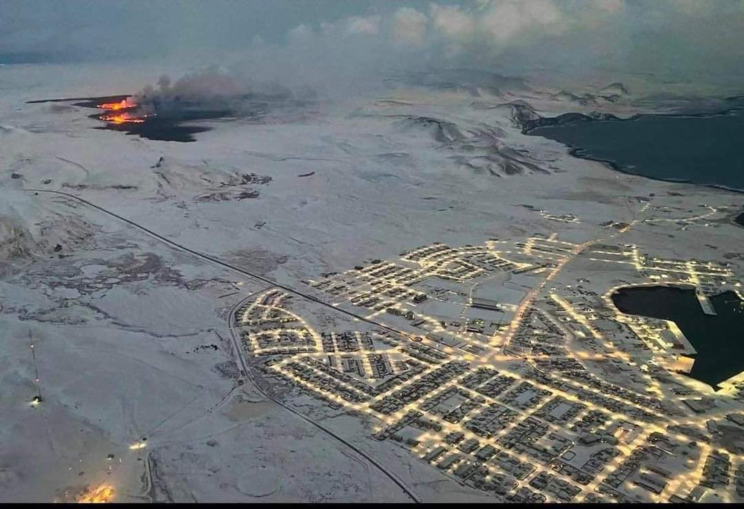 Stunning aerial view of the current eruption site and Grindavík (bottom right) (image: Volc-Han-ology/twitter)