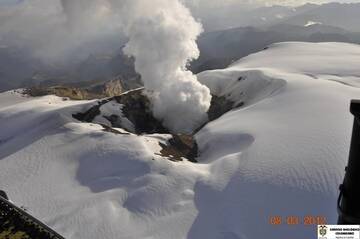 The snow-caped summit and steaming crater of Nevado del Ruiz volcano on 8 March