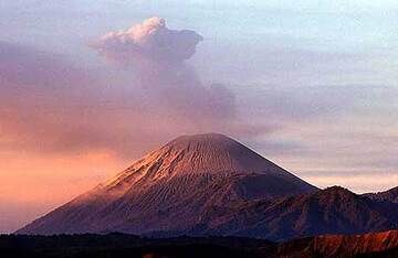 Erupting Semeru volcano in the first morning light
