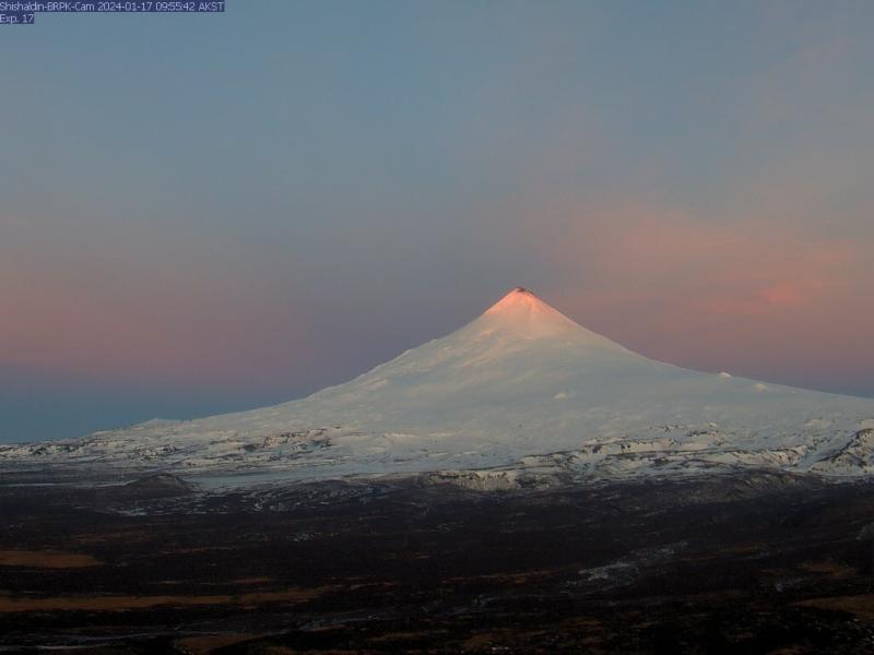 The black-colored summit vent of Shishaldin volcano this morning resulted from mild ash emissions (image: AVO)