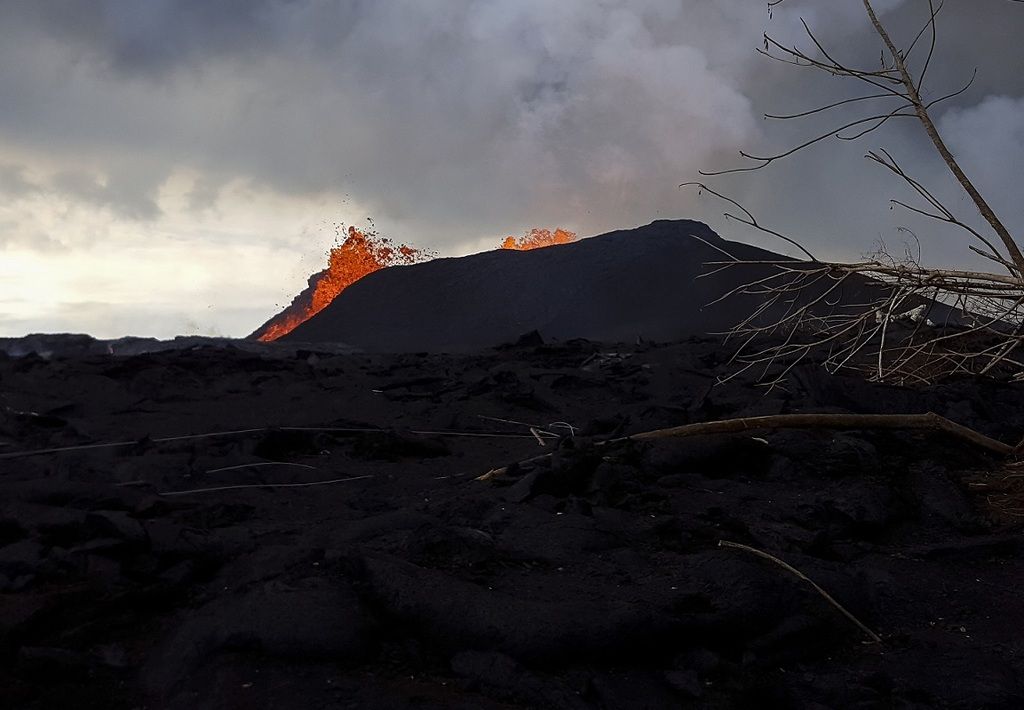 13 June photographs showing Fissure 8 lava fountains that reach heights of 40-45 m (130-150 ft) from within the growing cone of cinder and spatter, which is now about 40 m (130 ft) at its highest point. (HVO/USGS)