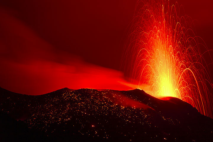 Typical "normal" strombolian eruption from a vent of the NW crater at night.