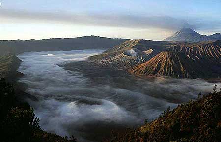 The Tengger caldera at sunrise with smoking Bromo volcano and Semeru in the background