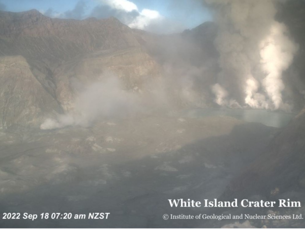 Grey-to-brown ash emissions mixed with gas emissions emitting from the crater on 18 September as visible in a hazy webcam image (image: GeoNet New Zealand)
