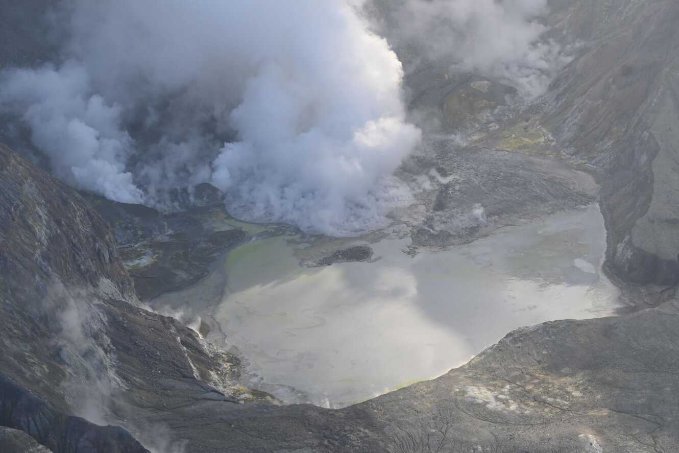 View into the crater of White Island volcano on 31 May showing steam and gas emissions from vents and the lake (image: GeoNet New Zealand)