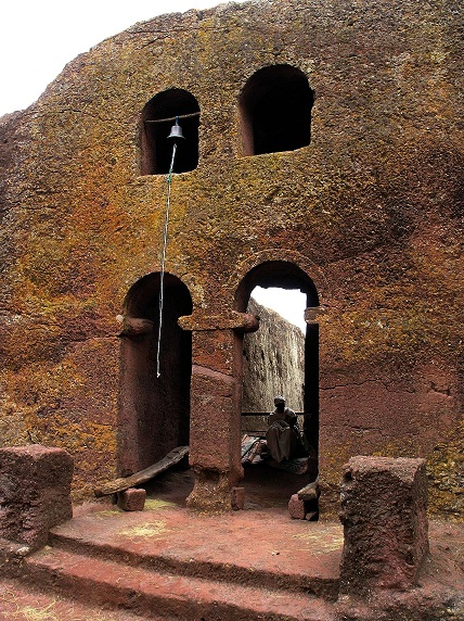 Doorway windows and church bell outside the rock hewn ´Tomb of Adam´