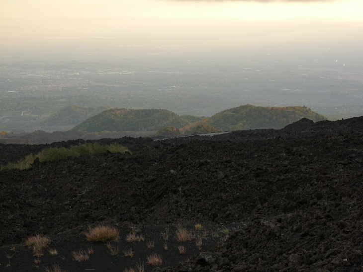 Etna´s southern lower slopes with lava flows and cinder cones at dusk