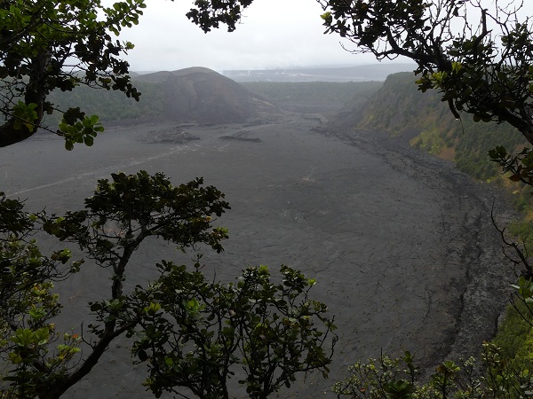 View from the surrounding rainforest down to Kilauea Iki´s frozen lava lake and eruption vent