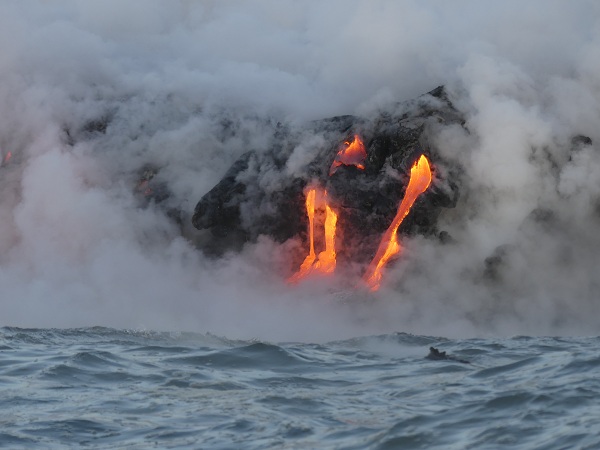 Red-hot lava flowing into the ocean