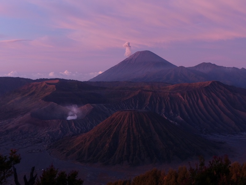 Small eruption from Semeru (background) shortly before sunrise