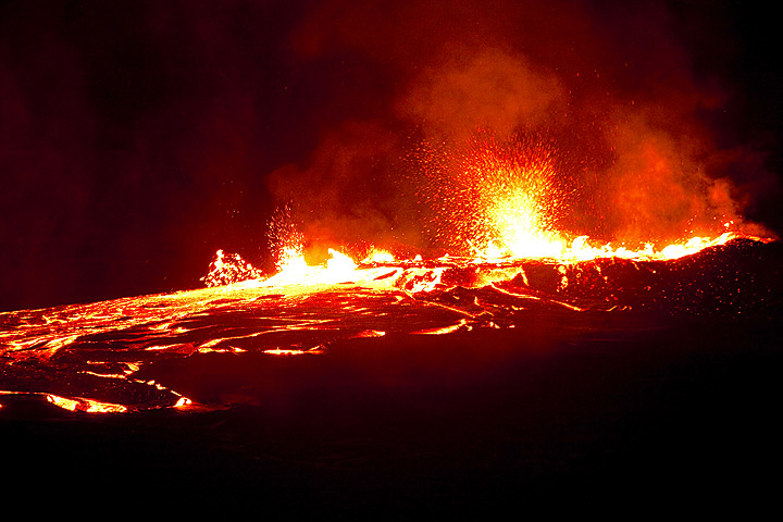 Nighttime impression of lava flow and spattering from the overflowing lava lake (Dec 2010; image: Tom Pfeiffer)