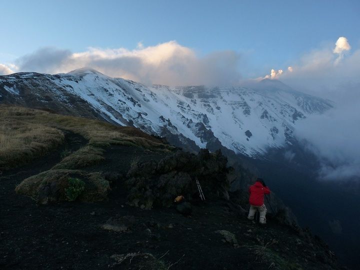 First snow covers the upper slopes and summit area of Mt Etna