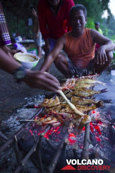 Grilling freshly caught fish for dinner