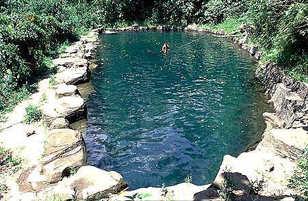 Warm, volcanically heated natural pool in the jungle