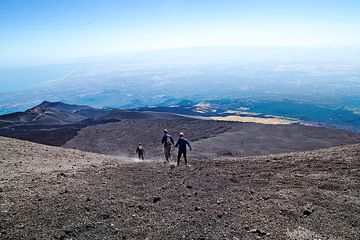 Hand in hand walking down Etna's Summit Craters.