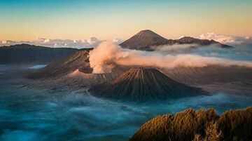Morning mists in the Tengger caldera with erupting Bromo in the foreground, August 2016 (photo: Chris Kay)