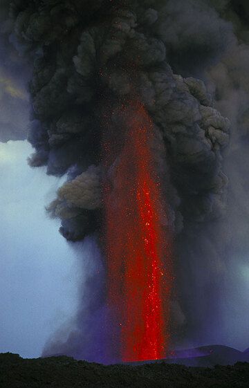 Lava fountain at Etna during the 2001 eruption. The activity is phreatomagmatic in origin, which explains the large amount of ash involved in the fountain: the rising water on its way meets wet layers where the contact between water and magma produces violent fragmentation.