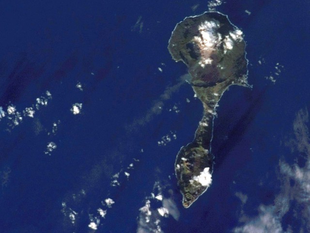Thin ash plume extending SW from Pagan on 11 January 2007 (NASA earth observatory).