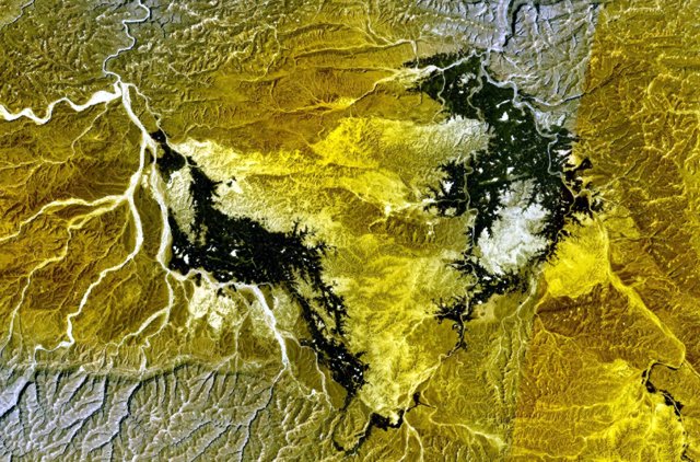 NASA Landsat7 image (worldwind.arc.nasa.gov) showing the darker lava flows of Borhut volcano south and west of the Wadi al Masilah in eastern Yemen