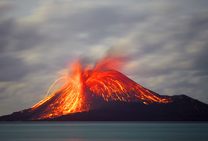 Violent eruption of Krakatau showering the summit cone with incandescent bombs.