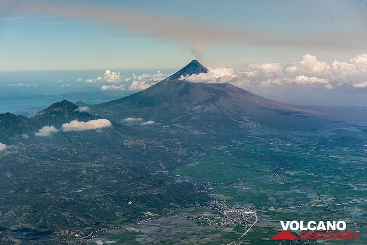 Masaraga volcano (left in the picture) with its taller and active neighbor, the Mayon stratovolcano seen during approach for Legazpi airport.